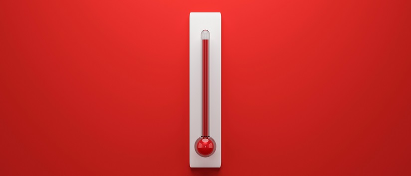image of thermometer with a high level against a red background